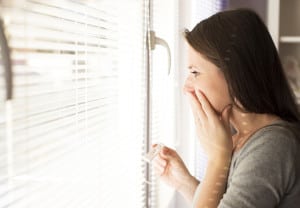 Happy woman with positive pregnancy test result. She is excited at home.
