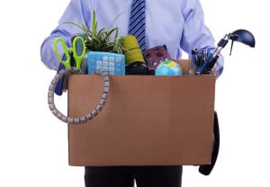 Unemployment concept, fired man with personal items in a box