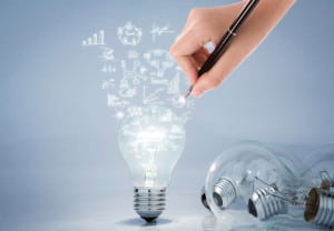 Light bulb with hand drawing graph