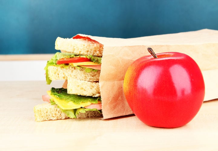 School breakfast on desk on  board background