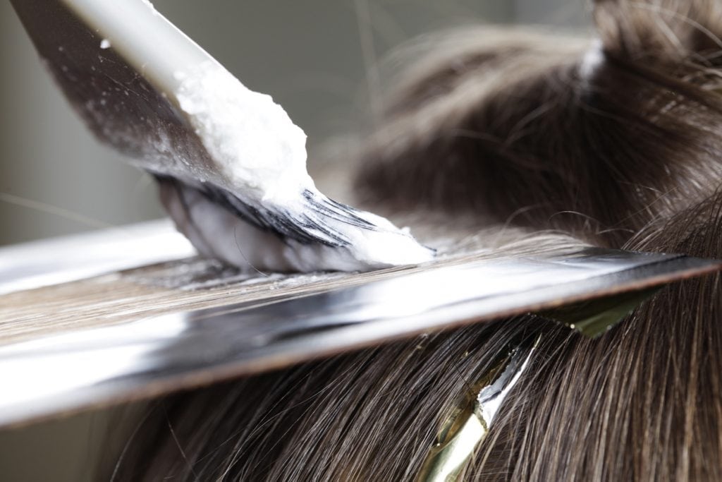 Close up of highlight application with bleach